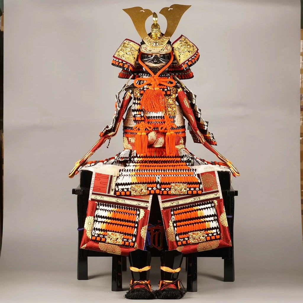 Complete scaled samurai armor on tiered display stand with folding screen